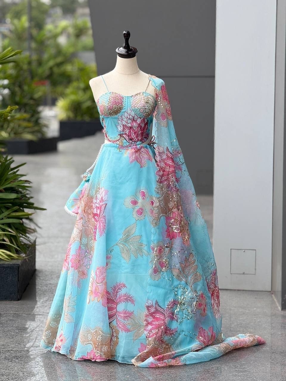 Sky blue organza lehenga set with batwa bag - Image 1